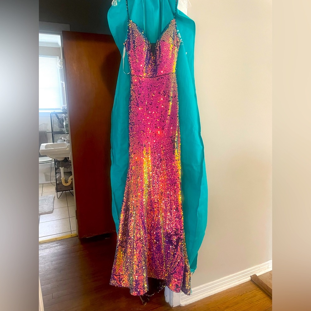 NWT Tags prom dress. It is a size 00-4, with a corset back. Never worn